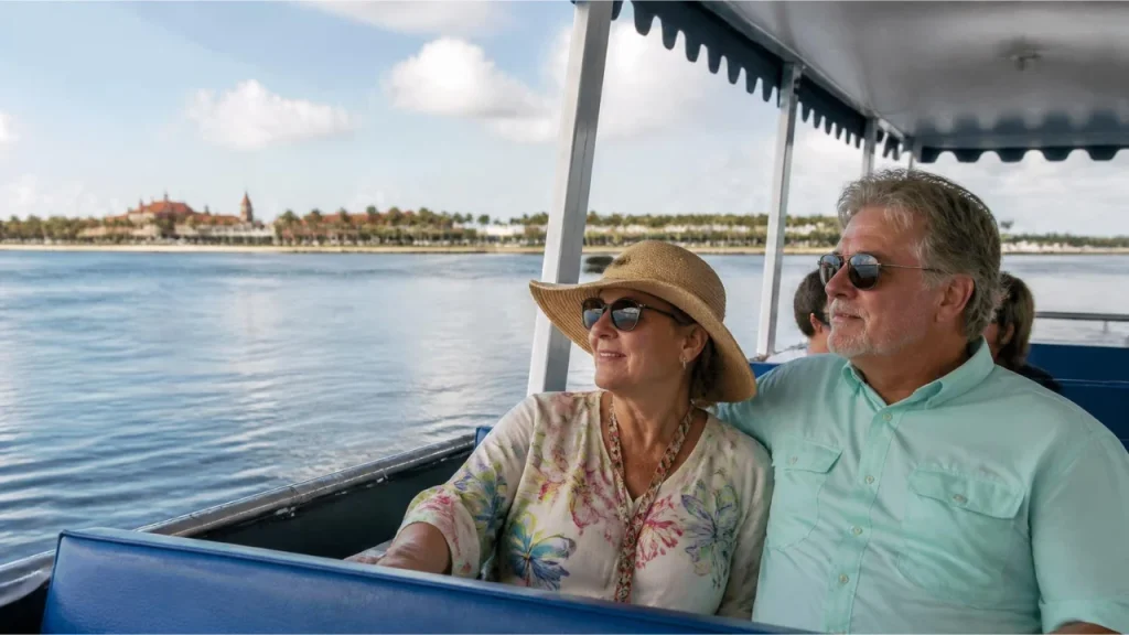 Older travelers enjoying views of Matanzas Bay from shaded seats on a sightseeing boat