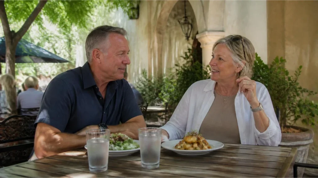 Couple enjoying a leisurely lunch at a shaded outdoor café in St. Augustine’s historic district